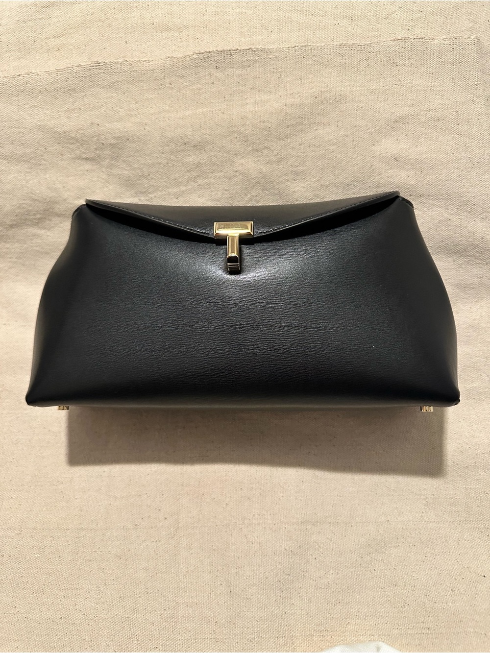 TOTEME | Handbag | TOTEME T-Lock Clutch in Palmellata Leather